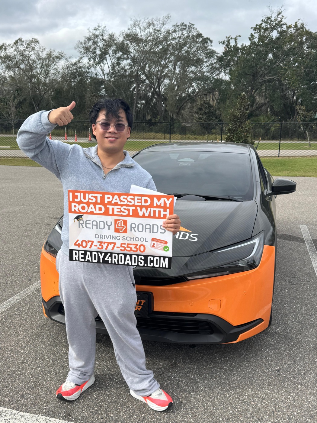 Bilingual driving lessons student celebrating road test pass with Ready 4 Roads in Kissimmee, FL